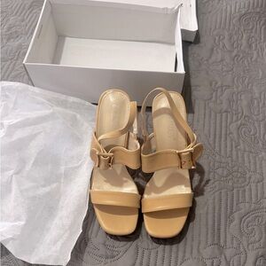 Nude Plarform buckle front heels